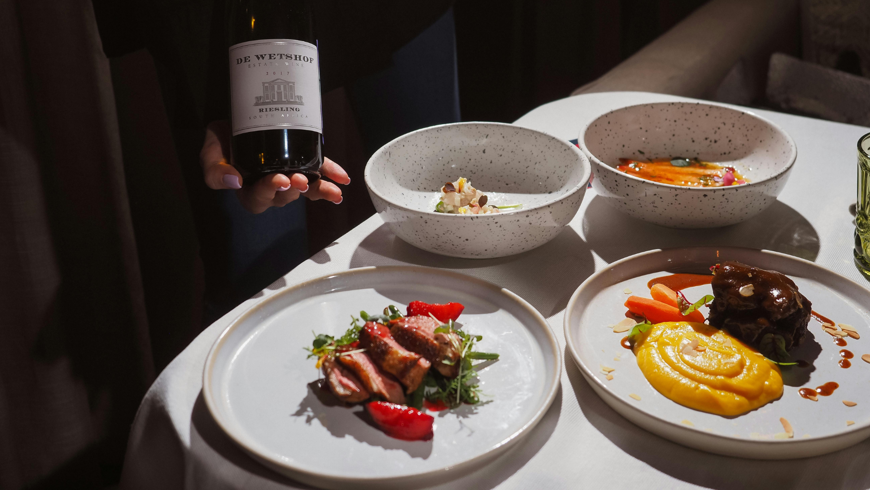 british-fine-dining-experience-with-red-wine.png