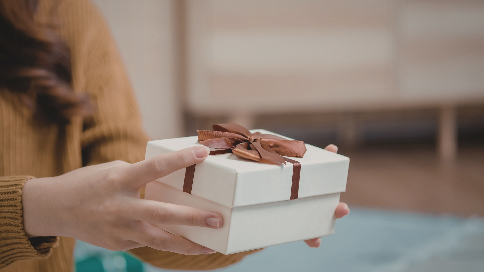 Person Handing Gift